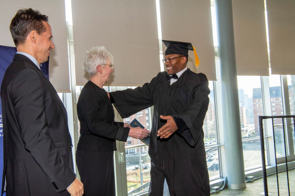 2022 Paralegal Program graduate Victor Wright receiving his certificate.