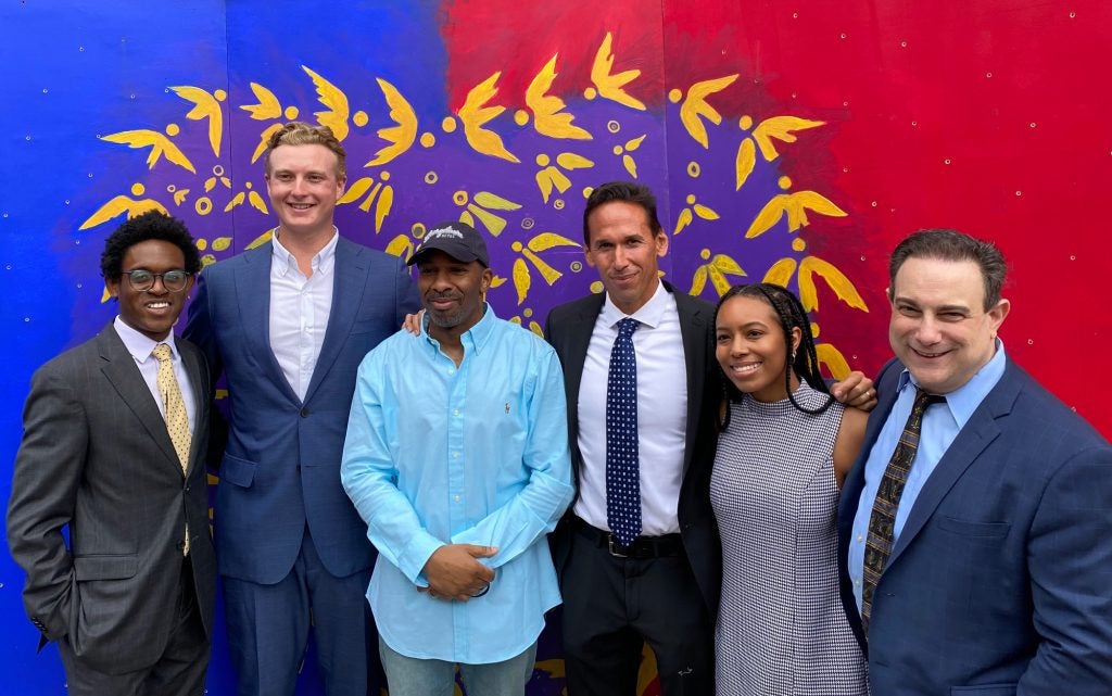 Eric Riddick with Georgetown alumni and faculty who worked on his case.