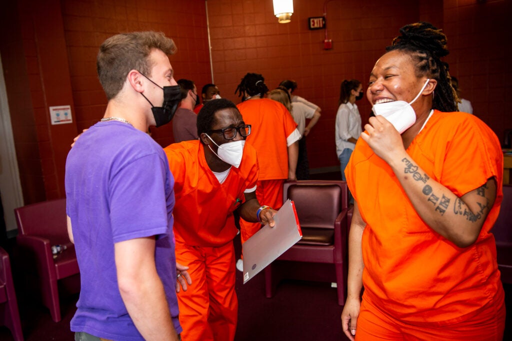 Three students laughing