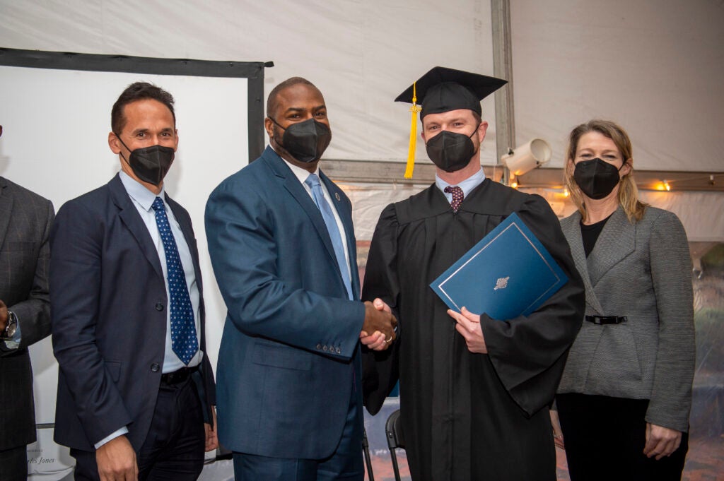 Guy Redford receives his certificate in Paralegal Studies at his graduation February 2022. 