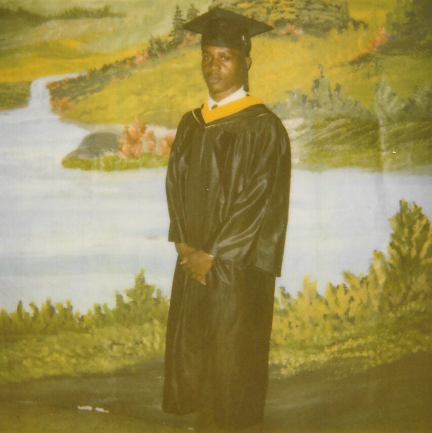 Tray Jones in a graduation cap and gown.