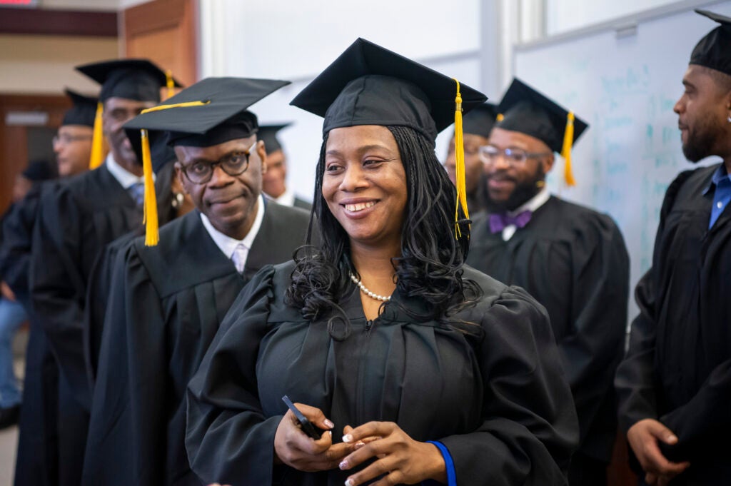 A woman in a graduation cap and gown