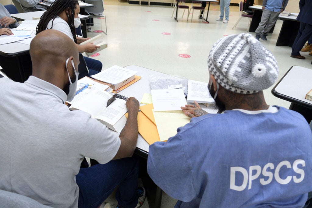 Incarcerated students do classwork.