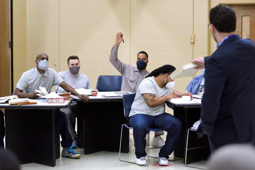 A student raises his hand in class